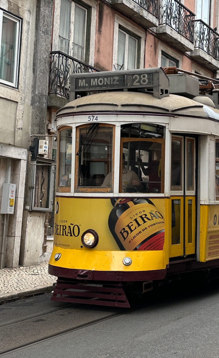Lisbon yellow tram street photo